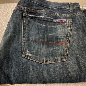 Faded jeans with distressed bottom and 32 inseam. Nice fit.